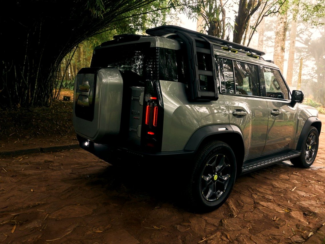 Jetour T2 rear three-quarter view under bamboo