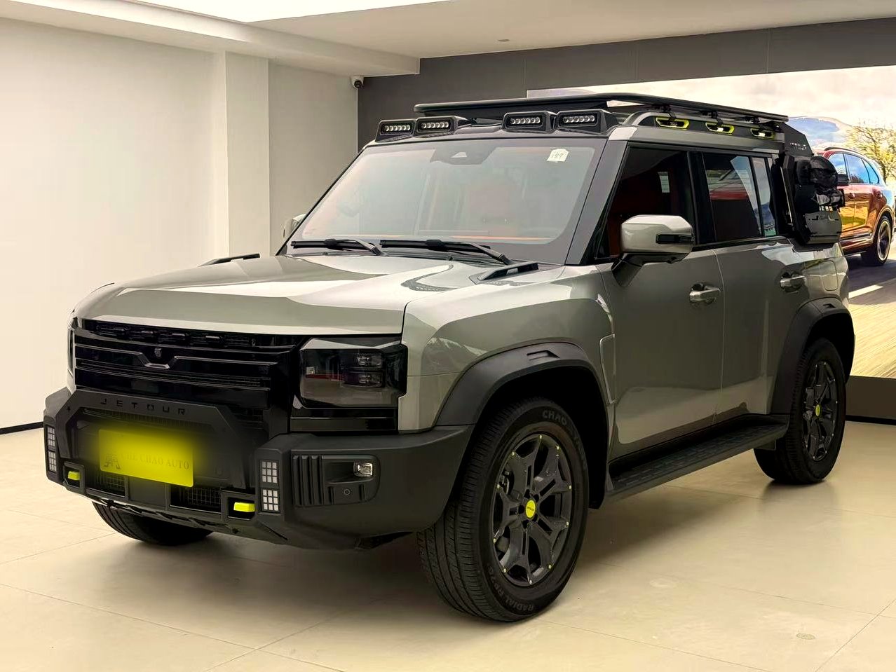 Jetour T2 front three-quarter in showroom, alternate angle