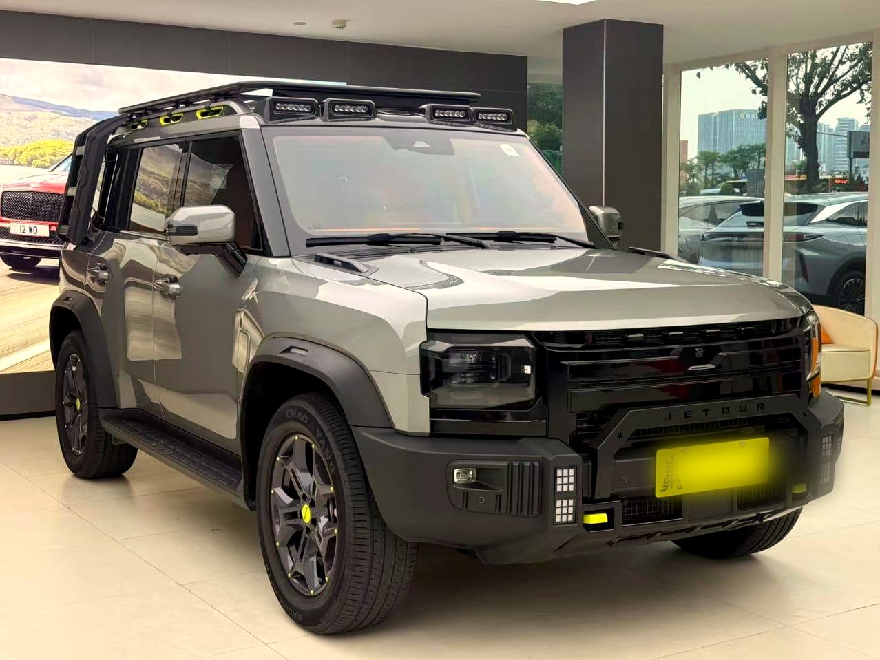 Jetour T2 front three-quarter in showroom